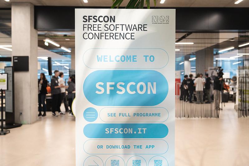 Welcome poster for SFSCON25, featuring the program.