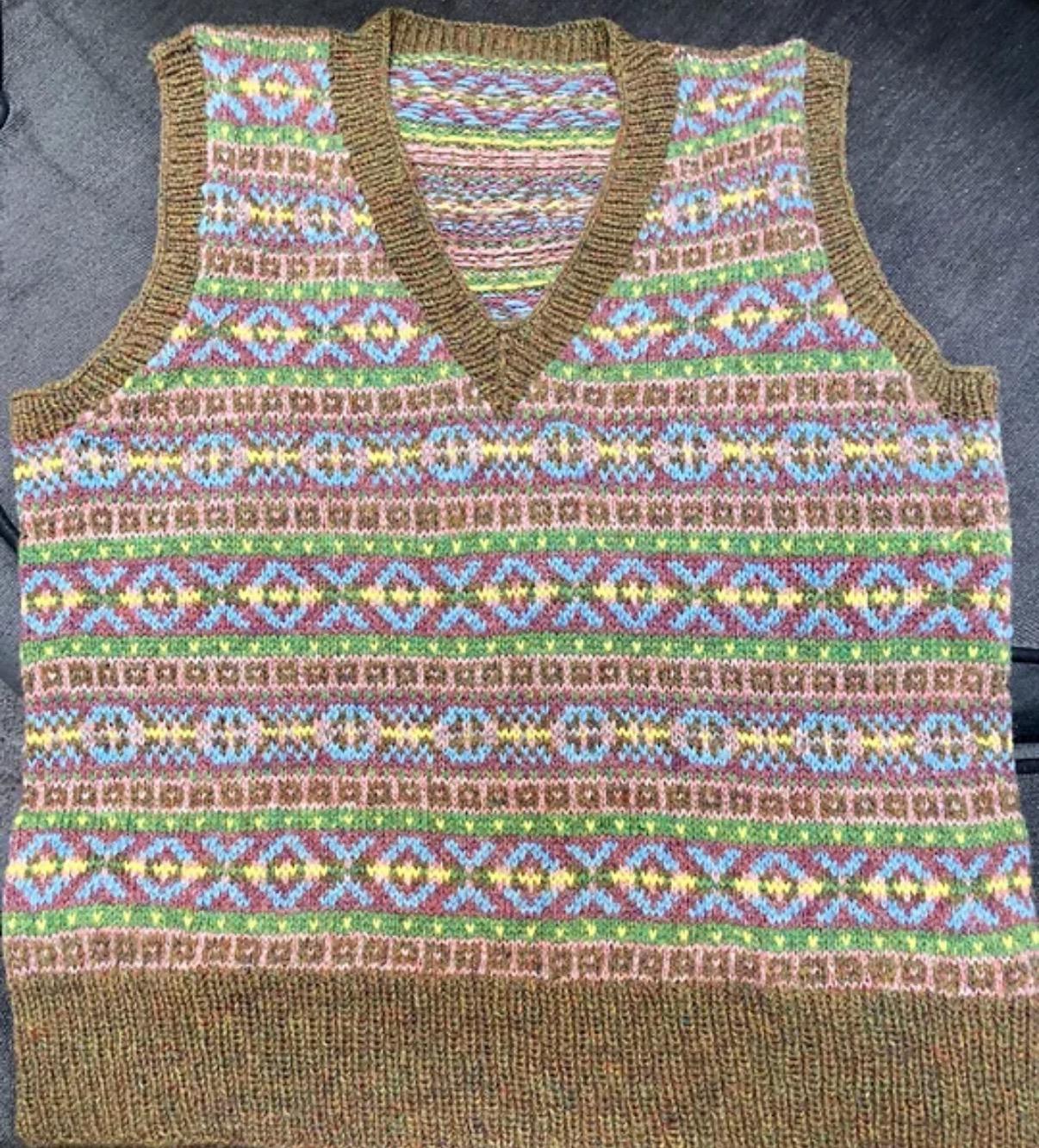 A fair isle vest top in brown, blue, pink and yellow