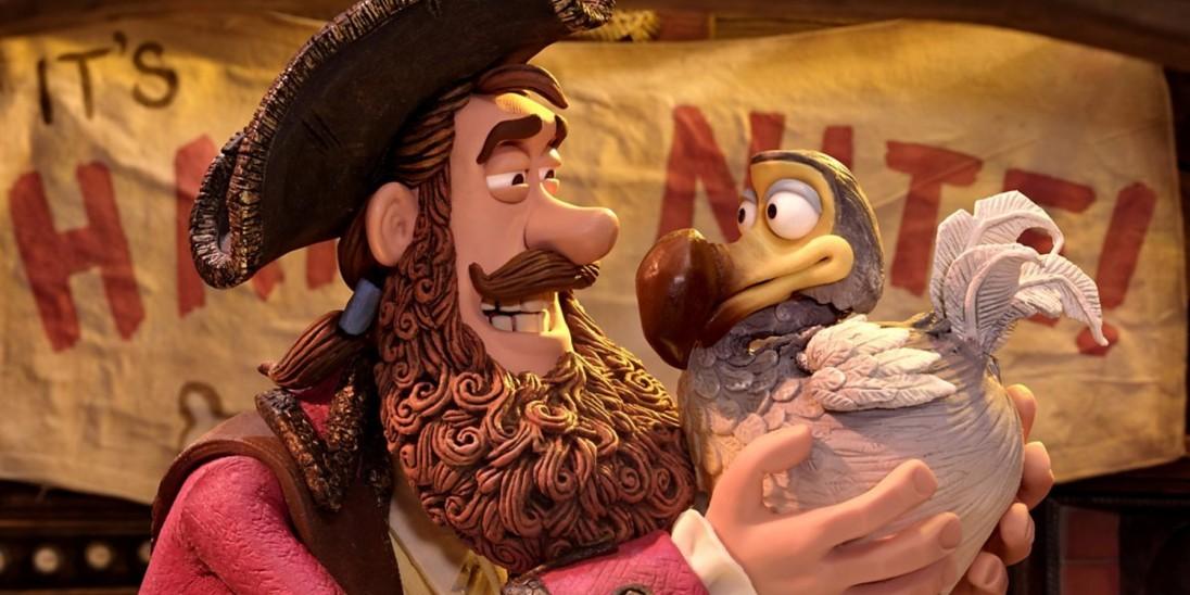 A screenshot of the Pirate Captain and Polly from Pirates in an Adventure with Scientists. Polly the Dodo is a rotund bird with blue and white plumage, a bulbous brown beak and bulging eyes 
