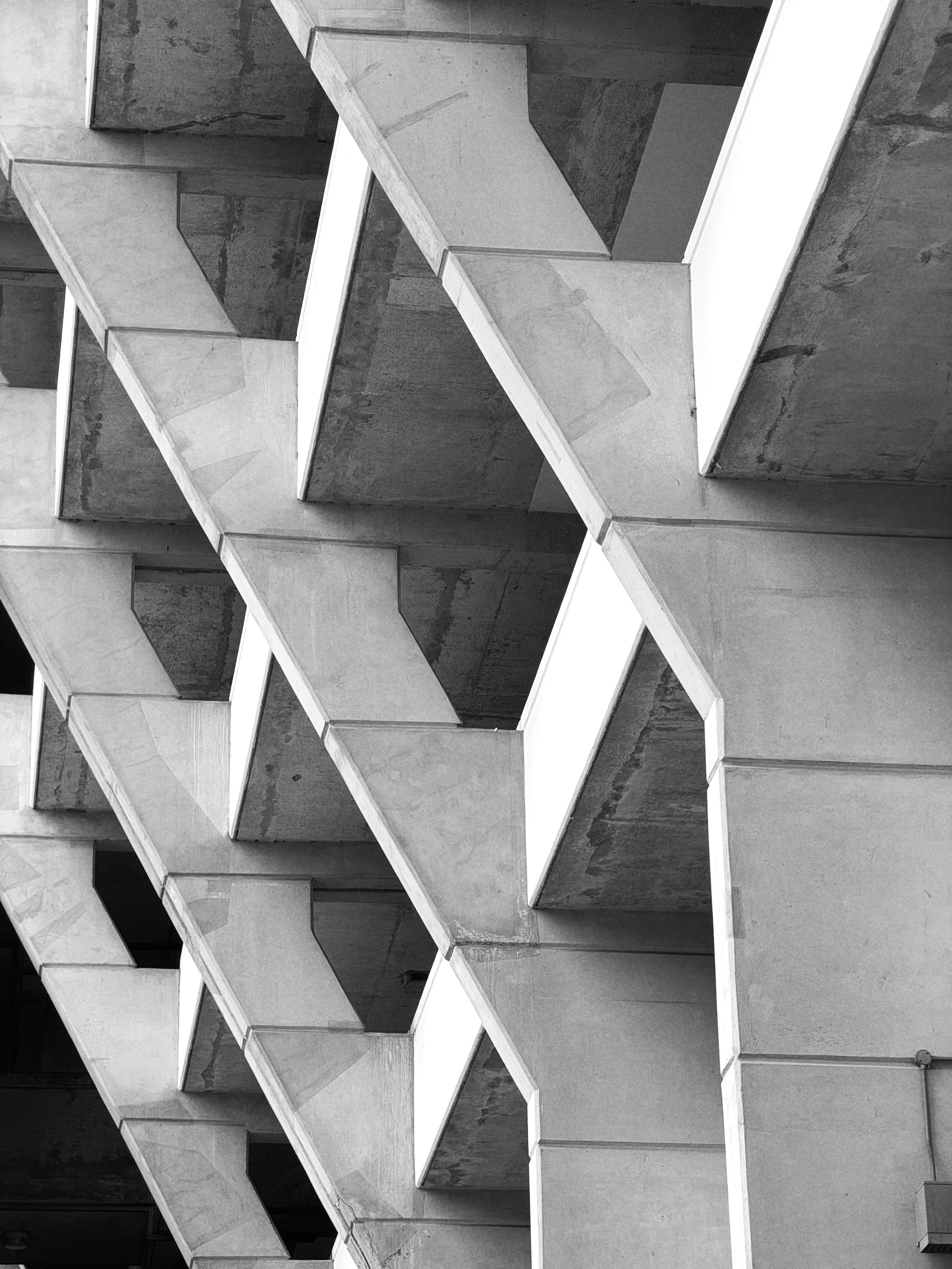 Black and white photo of the Brunswick Centre’s concrete architecture — repeated diagonal support structures 