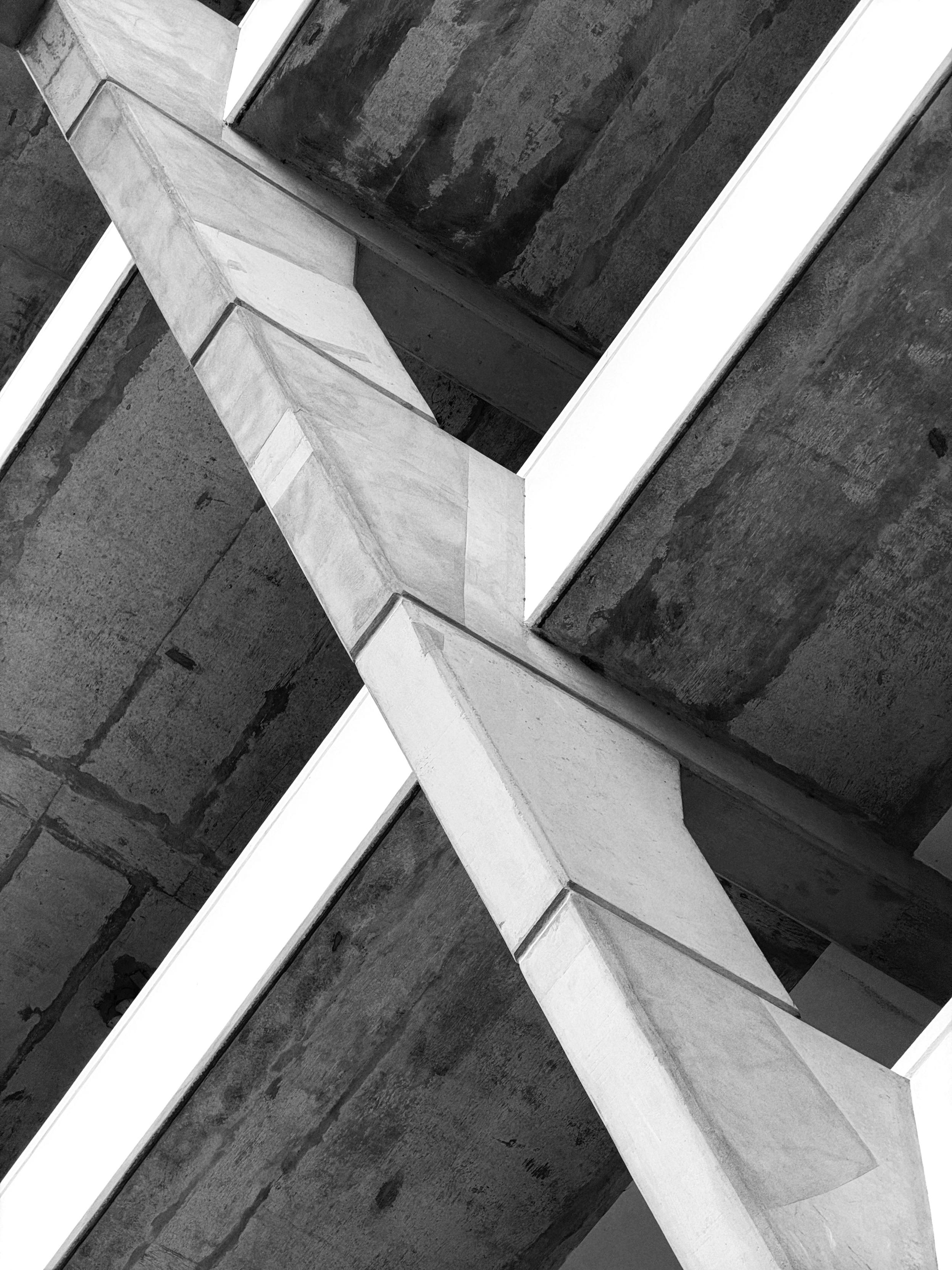 Black and white photo of the Brunswick Centre’s concrete architecture — a diagonal support for multiple open floors