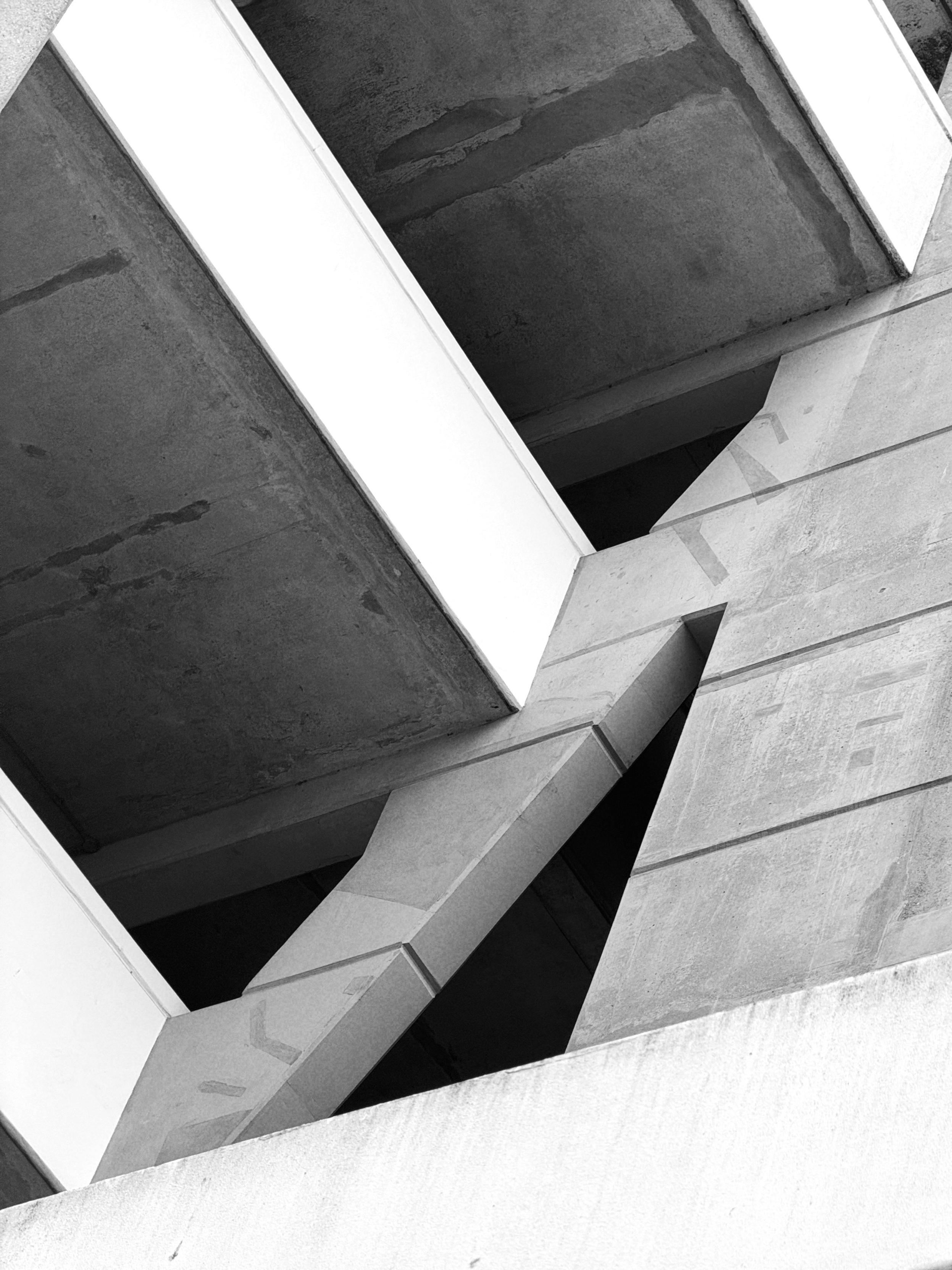 Black and white photo of the Brunswick Centre’s concrete architecture — tiered levels with deep black openings