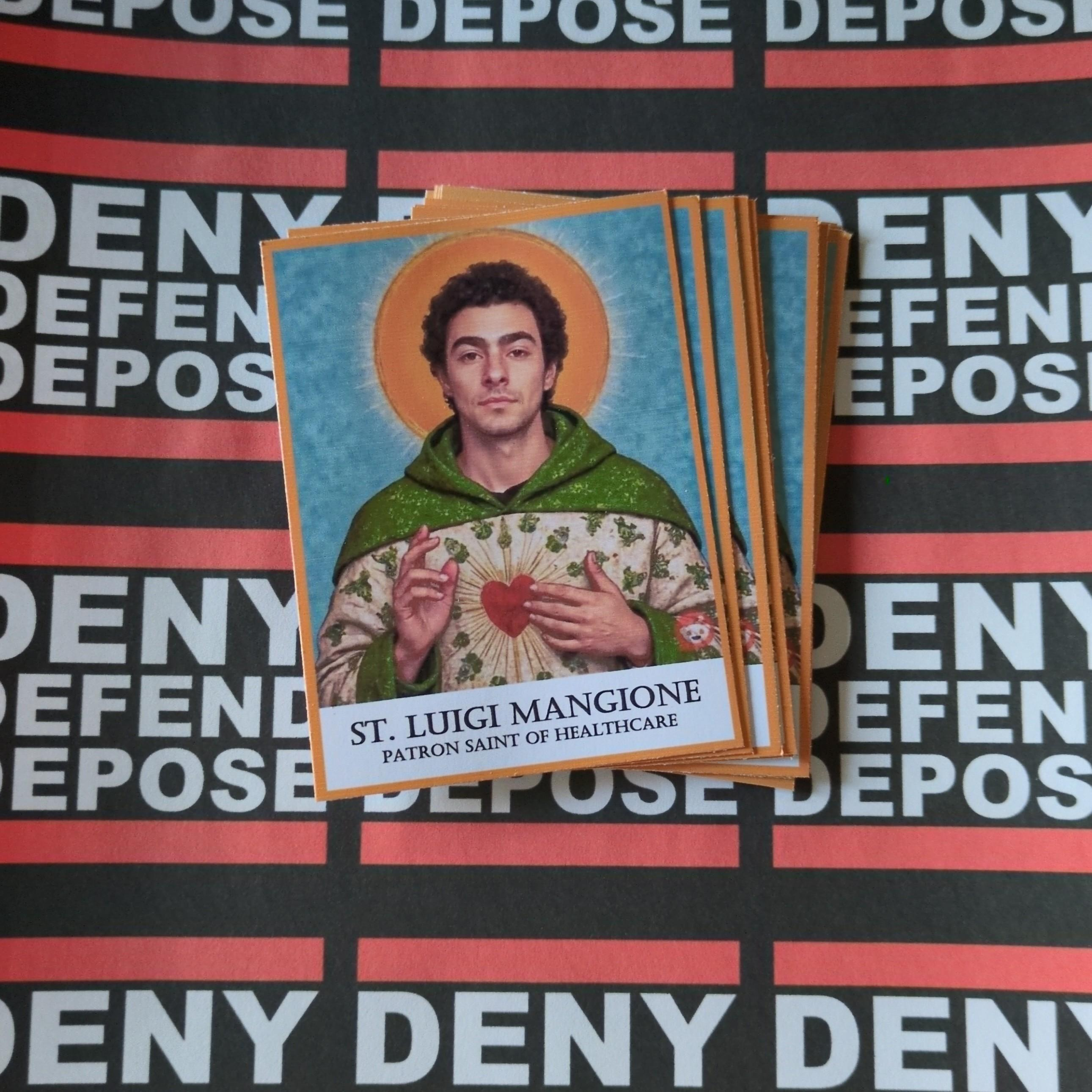 Holy cards of Luigi Mangione wearing a tunic and a halo, with the inscription below: ST. LUIGI MANGIONE PATRON SAINT OF HEALTHCARE