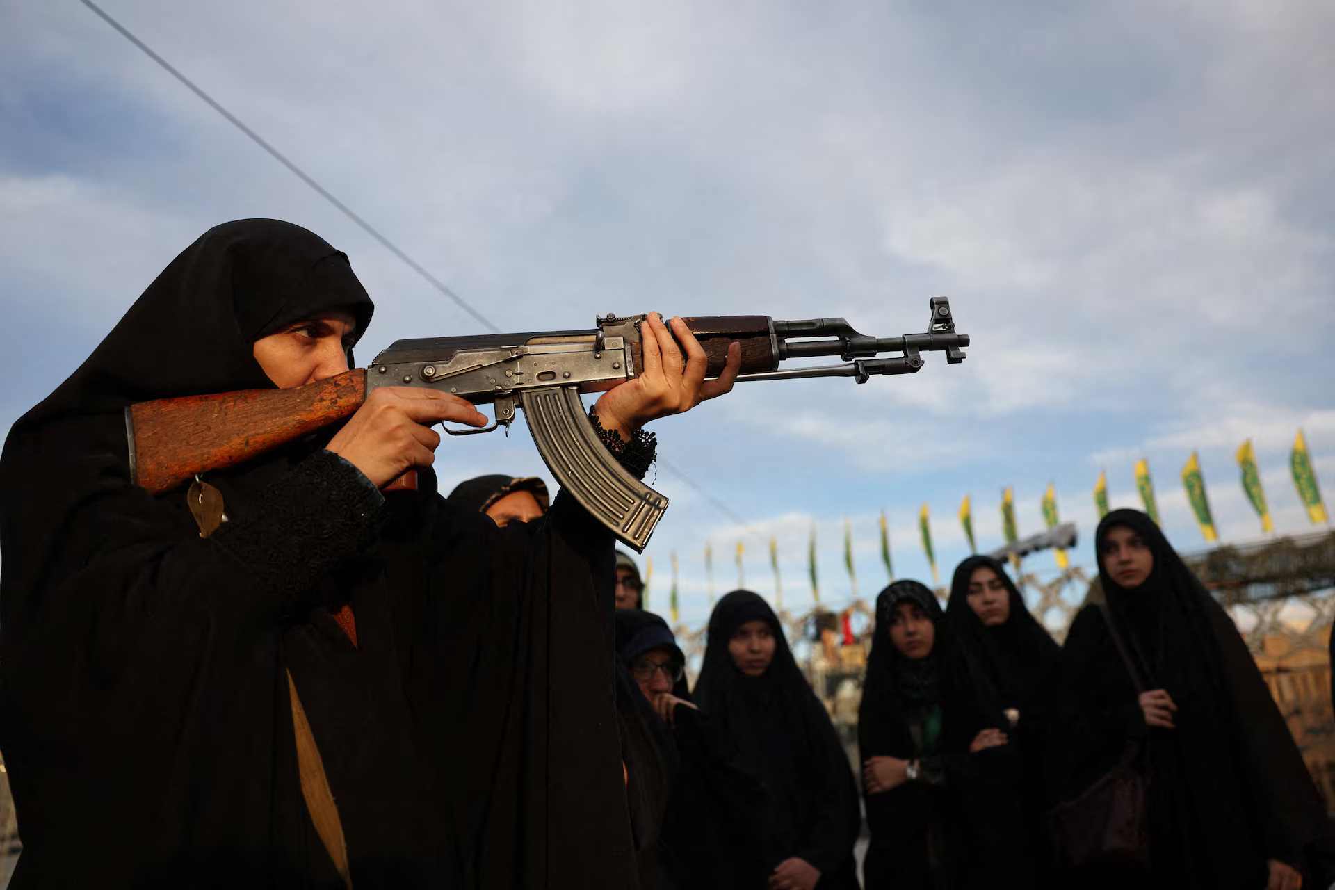 An Iranian woman volunteer receives military training.