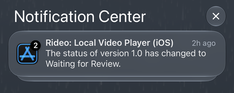 A notification from the Notification Center on a smartphone, showing an app icon for "Rideo: Local Video Player (iOS)" with a badge indicating two updates, and text stating, "The status of version 1.0 has changed to Waiting for Review." The timestamp shows "2h ago."
