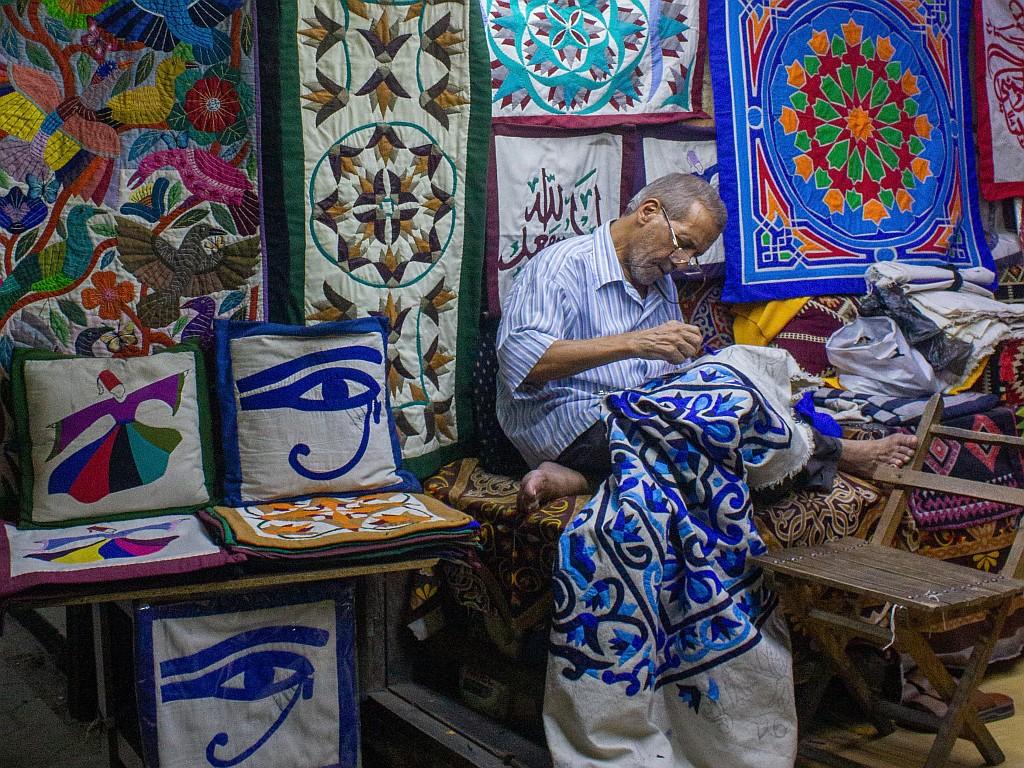 ‘This photo is from the famous “Street of the Tentmakers” in historic Cairo, one of the few places where the ancient art of appliqué (khayamiya) still survives. I found this craftsman, a patriarch of his trade, working in the same spot he has for decades. His focused concentration and weathered hands tell the story of a lifetime dedicated to preserving a cultural heritage.’