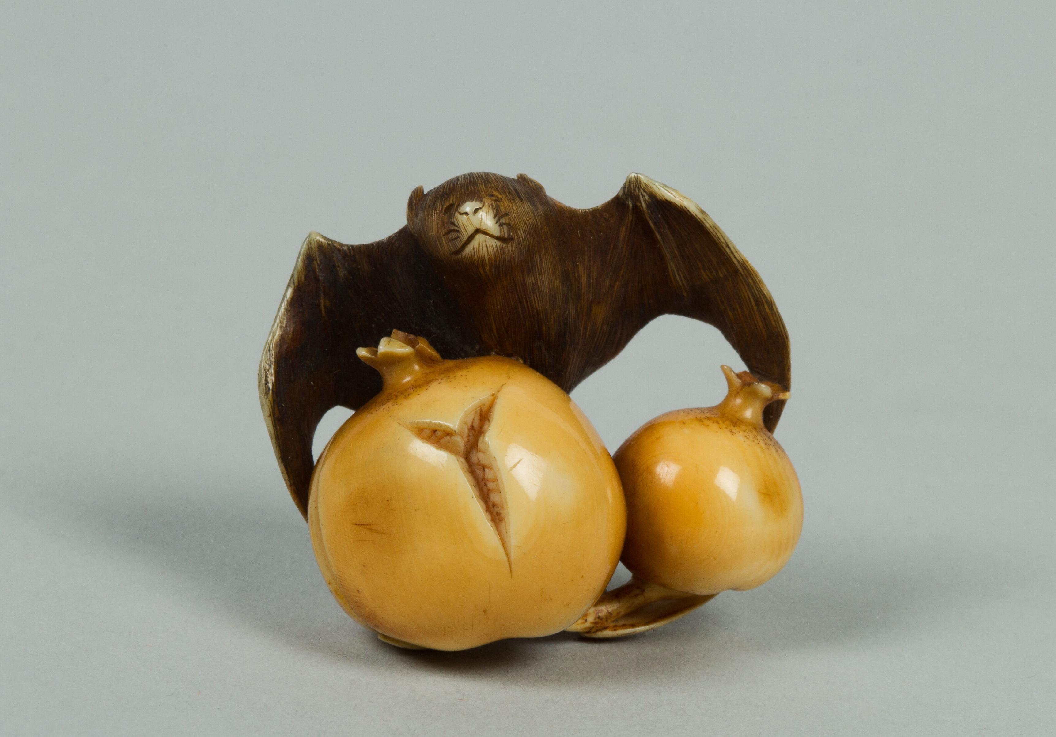 Bat and pomegranate shaped netsuke.

Image thanks - https://collectionapi.metmuseum.org/