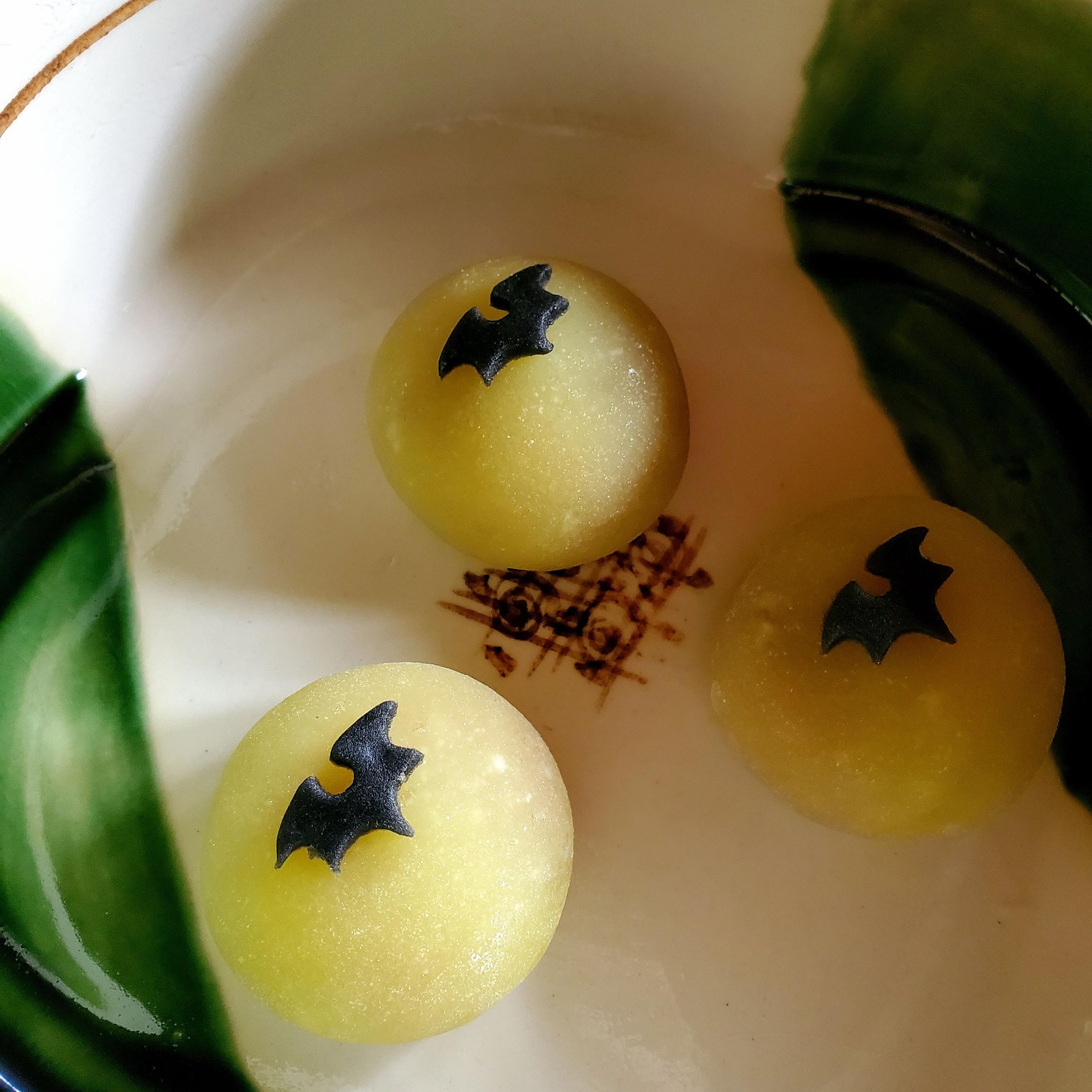 Sweet depicting a bat flying over a full moon.